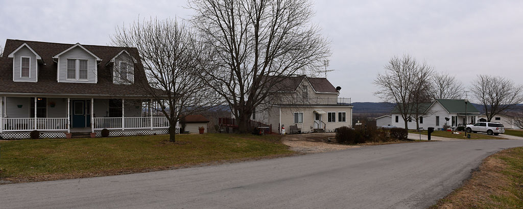 Houses owned by three generations of the Wehrle family sit in a row